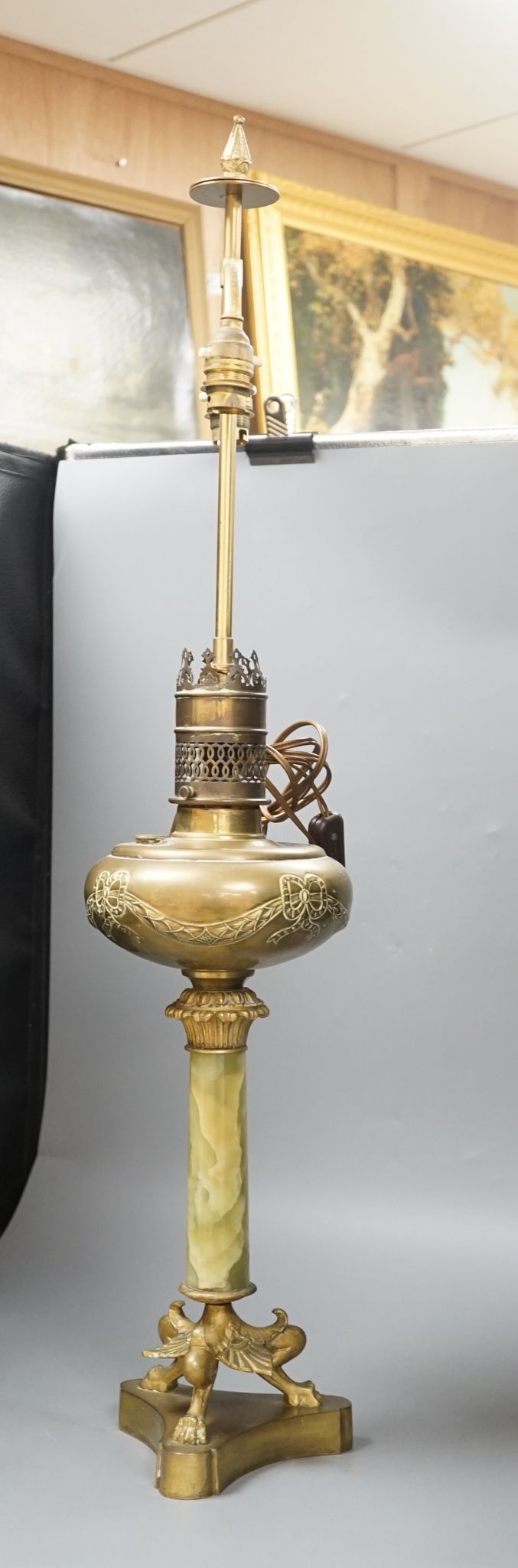 A French gilded bronze and green onyx oil lamp (converted to electricity later), 84 cms including light fitting.